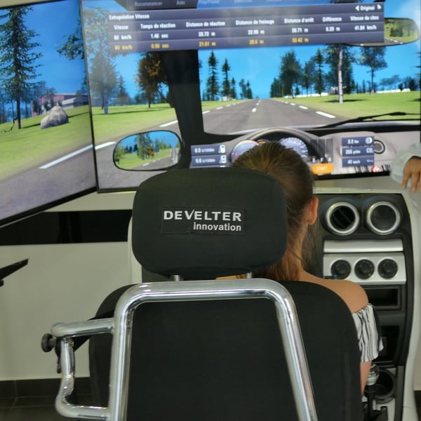 Women sitting in a Develter training simulator