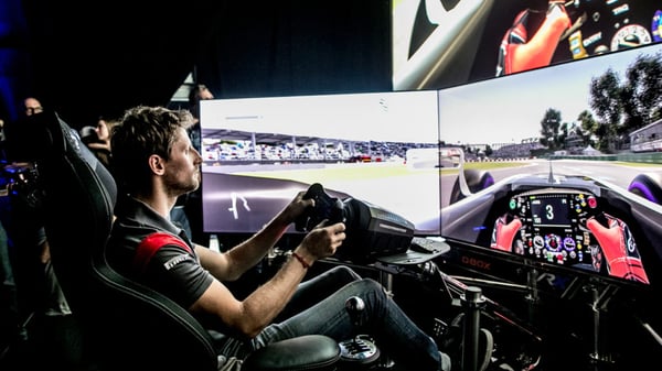 Men playing on a sim racing rig at Montreal Grand Prix