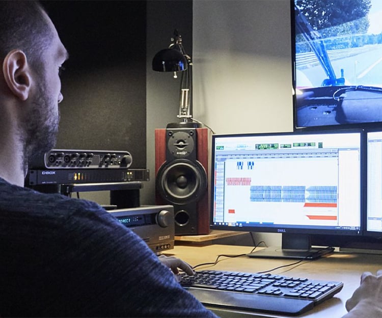 A D-BOX haptic engineer works on encoding a film