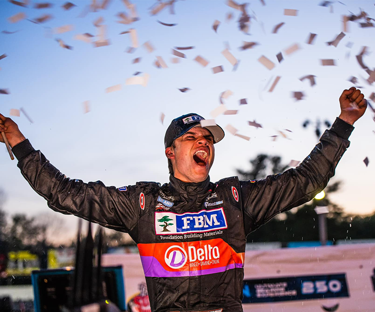 Treyten Lapcevich celebrates a victory after a race.