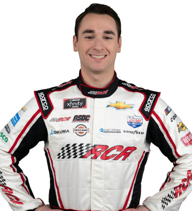 NASCAR driver Anthony Alfredo smiles in race suit